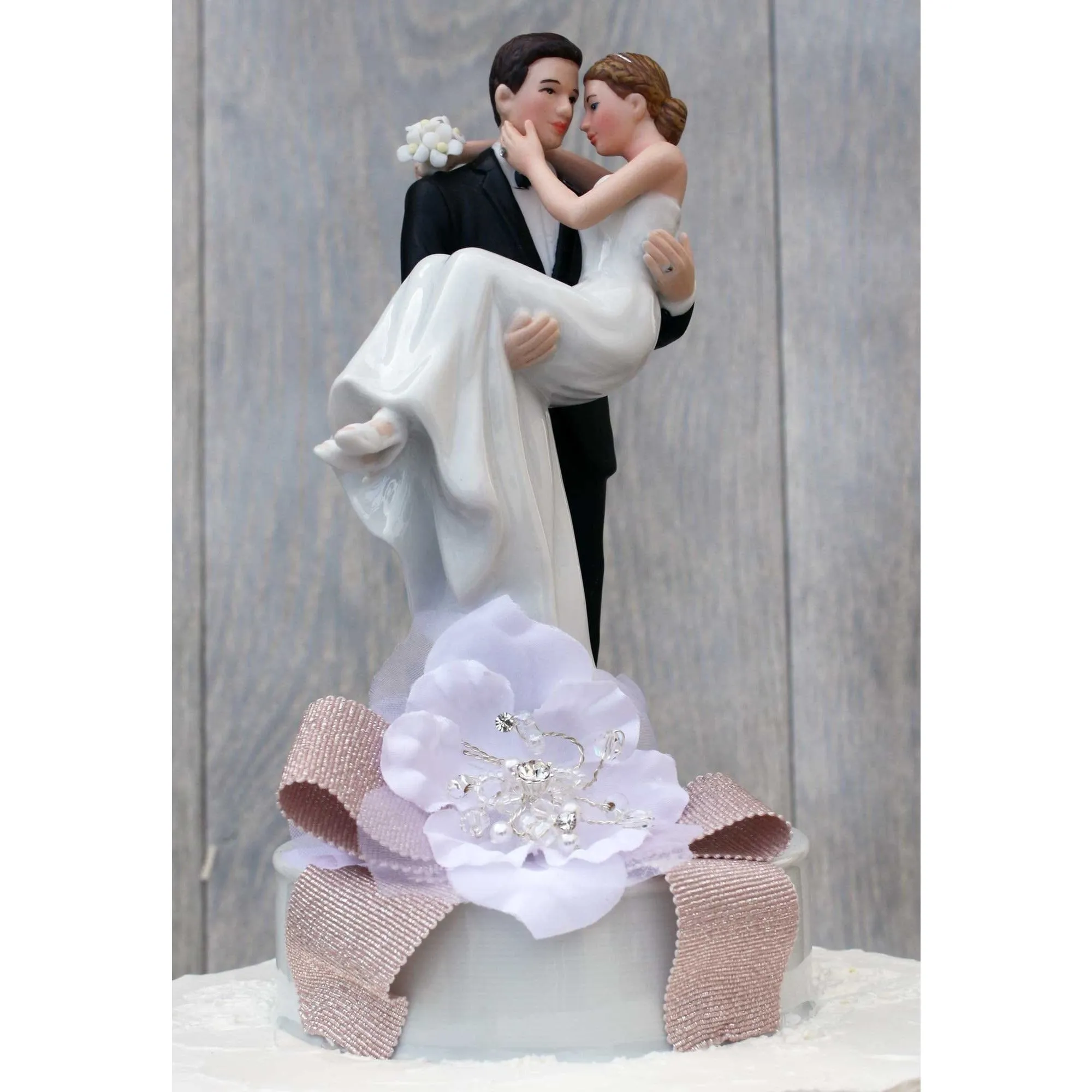 Ribbon Accent Groom Holding the Bride Wedding Cake Topper